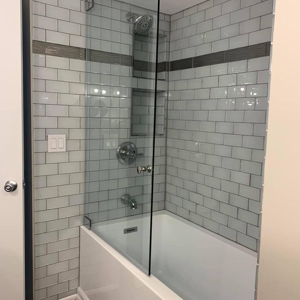bathtub and sliding glass shower